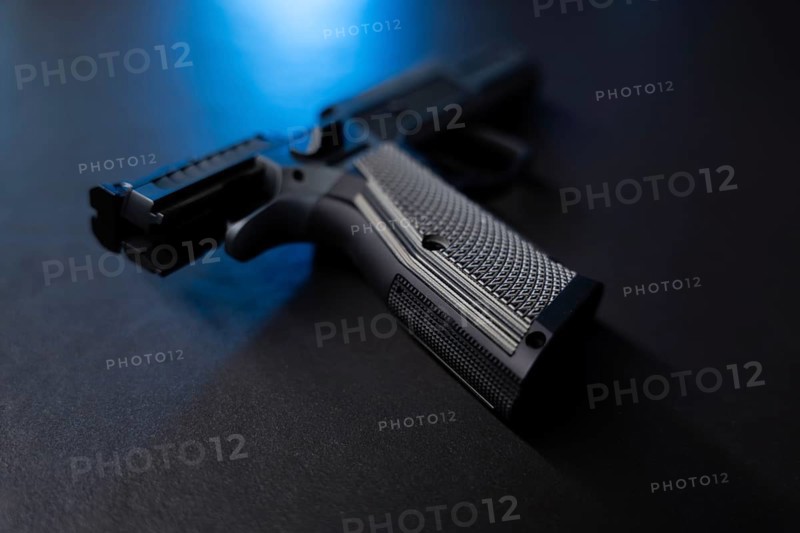 Modern Elegant Sport Handgun For IPDA with Blue Light on Grey Background in Switzerland