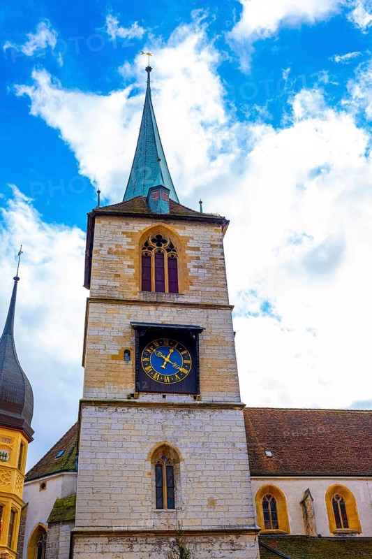 Old Town with House and Clock Tower with Sky and Clouds in a Sunny Autumn Day in City of Biel, Bienne, Bern Canton, Switzerland