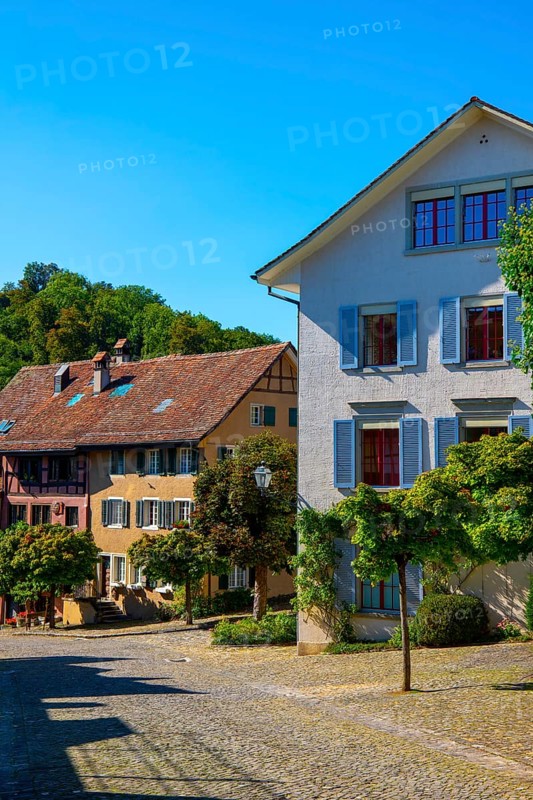 Medieval Old City Street with House in a Sunny Summer Day with Blue Sky in Regensberg, Zurich Canton, Switzerland