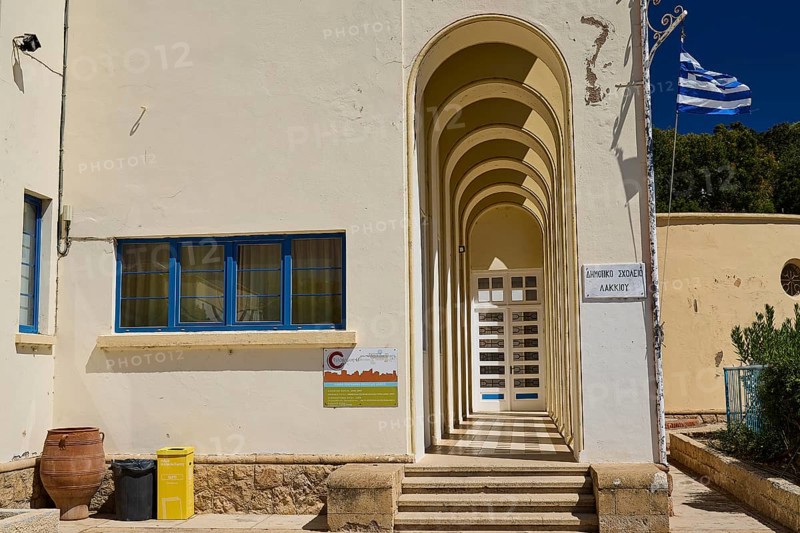 Primary school, entrance area with arches and Greek flag on the wall, Historicism, Art Deco, Rationalism, Portolago, Lakki, Leros, Dodecanese, Greek Islands, Greece