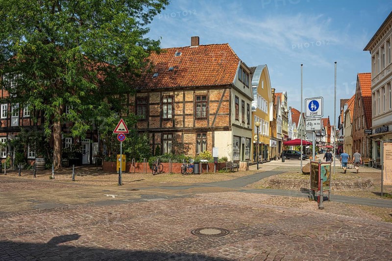Historic half-timbered houses with red bricks, quiet street neighbourhood with bicycles, Verden an der Aller, Lower Saxony, Germany