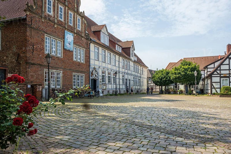 Historic half-timbered houses with cobbled square and roses. Quiet and peaceful atmosphere, Verden an der Aller, Lower Saxony, Germany