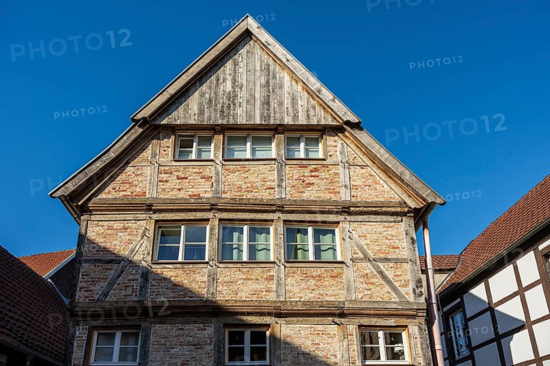 Large half-timbered house under a blue sky, representing traditional architecture, Warendorf, Münsterland, North Rhine-Westphalia