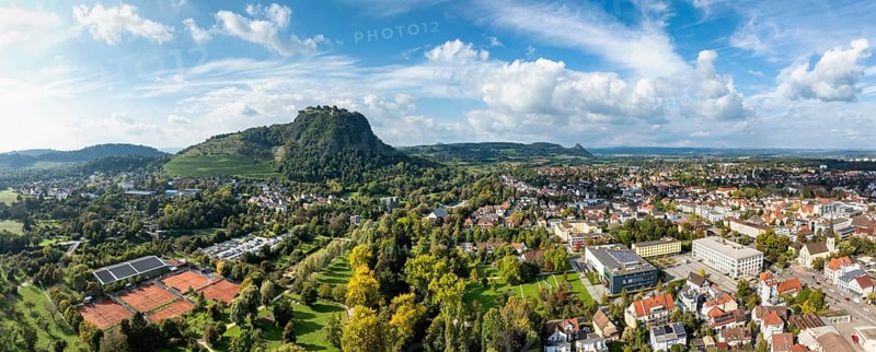 Aerial view of the town of Singen am Hohentwiel with the state garden show grounds, on the right the town hall and the town hall, on the horizon the Hegauberge mountains with the Hohentwiel and Germany's largest fortress ruins, district of Constance, Baden-Württemberg, Germany