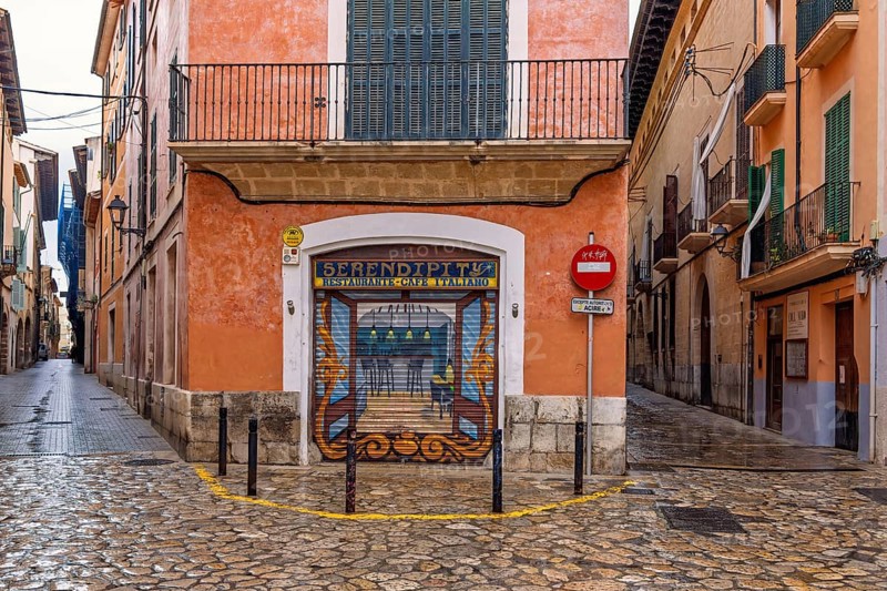 Mural painting on a jalousie to a street corner restaurant in the old town of Palma, Palma de Mallorca, Mallorca, Spain