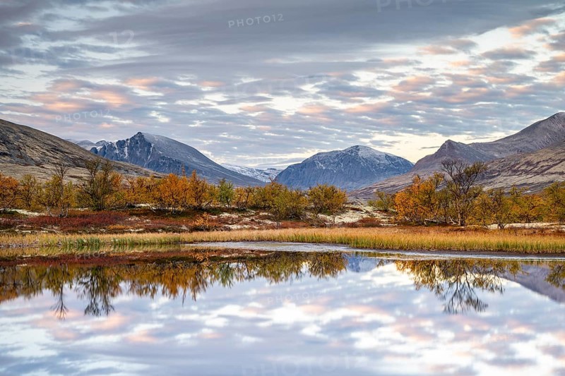 Reflection of the autumn landscape in Rondane National Park, Berge, Døråldalen, Norway