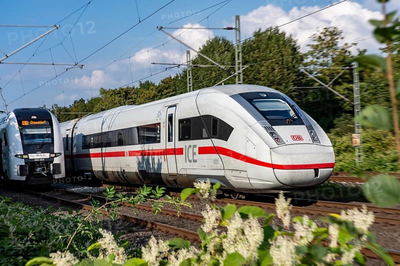 Train traffic on one of the busiest railway lines in Germany, ICE train between Duisburg and Düsseldorf, commuter trains, regional trains, ICE and IC long-distance trains and freight traffic, North Rhine-Westphalia, Germany