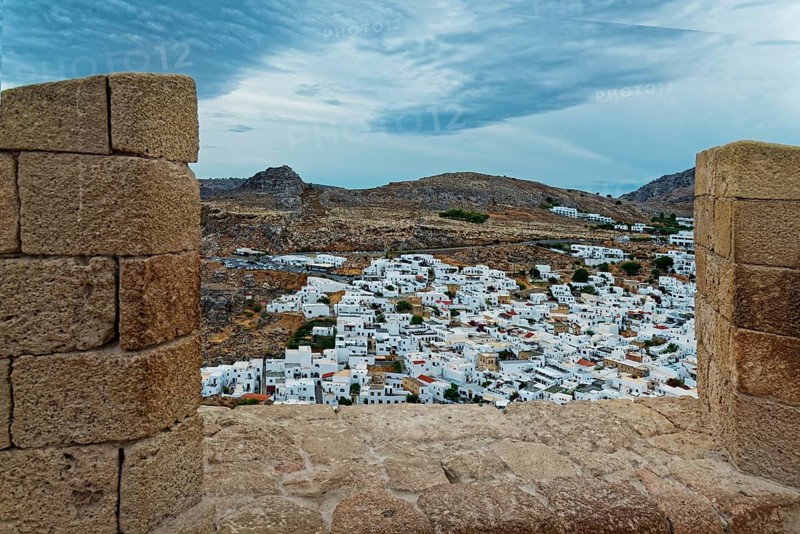 View from the Acropolis of Lindos to the city with white houses and cloudy sky, Acropolis, Lindos, Rhodes, Island, Greece