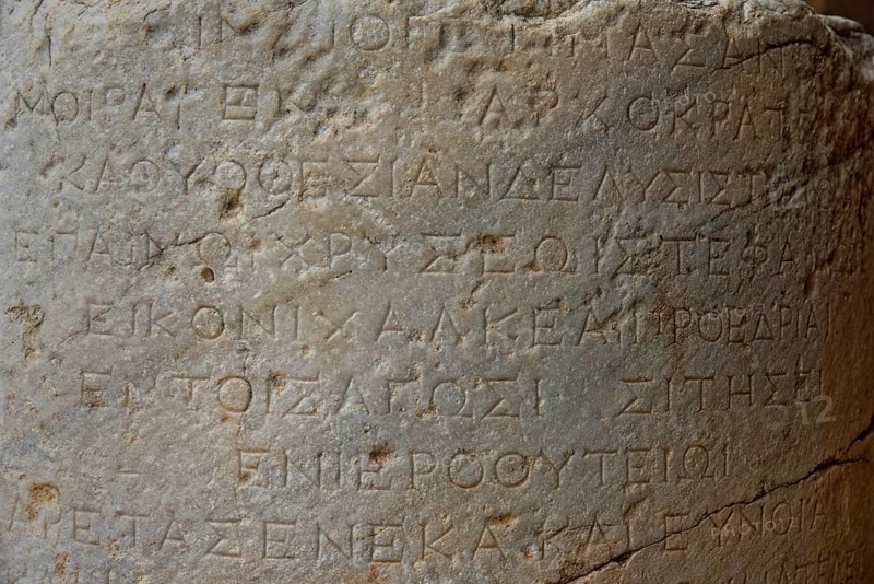Ancient Greek inscription carved in stone, with clear texture and traces of age, Acropolis, Lindos, Rhodes, island, Greece