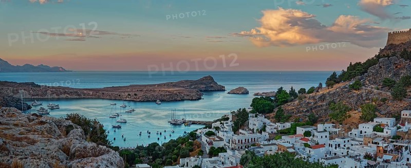 Harbour and coast of Lindos with boats at sunset, Acropolis, Lindos, Rhodes, Island, Greece