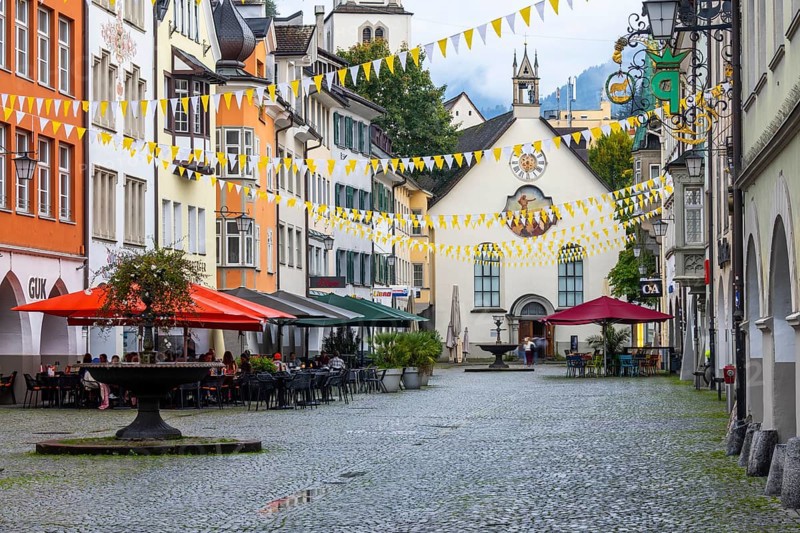 Market square, historic buildings, fountain, St John's Church, Feldkirch, Vorarlberg, Austria