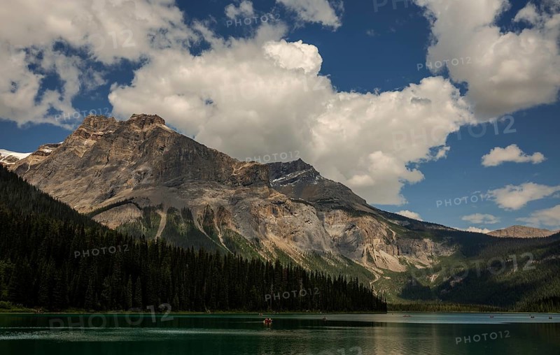 Majestic Canadian Rocky Mountains and tranquil Emerald Lake with a dramatic sky filled with clouds inside Yoho National Park, British Columbia, Canada, North America