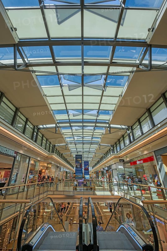 Shops, escalator and skylight in Forum Allgäu, Kempten, Allgäu, Swabia, Germany