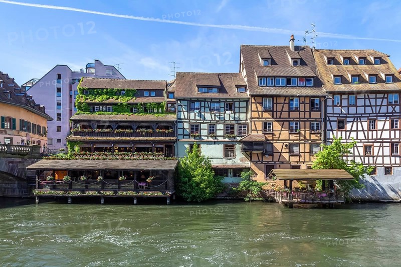 Idyllic waterside impression around a district named Petite France in Strasbourg, a city at the Alsace region in France