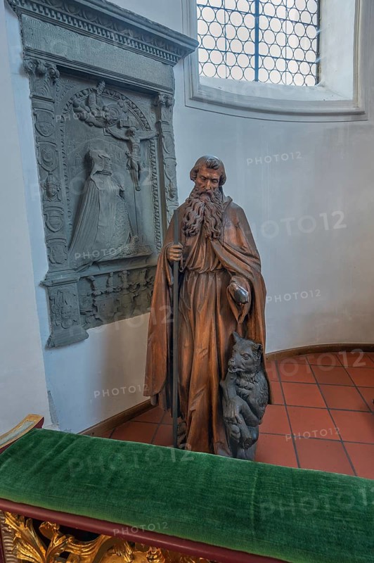 Church of St Gallus and Ulrich, figure of St Gallus with the bear next to an epitaph, Kisslegg, Allgäu, Baden-Württemberg, Germany