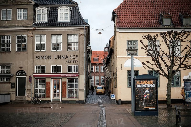 Narrow alley between historic buildings with a poster on the wall in Helsingor, Denmark, Northern Europe