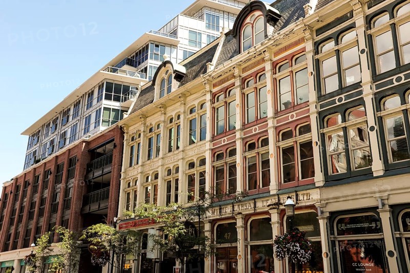 Row of historic buildings with ornate facades under a clear blue sky in Toronto, Ontario, Canada, North America