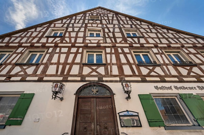 Pointed gable façade with half-timbering, Gasthof Goldener Adler in Kisslegg, Allgäu, Baden-Württemberg, Germany