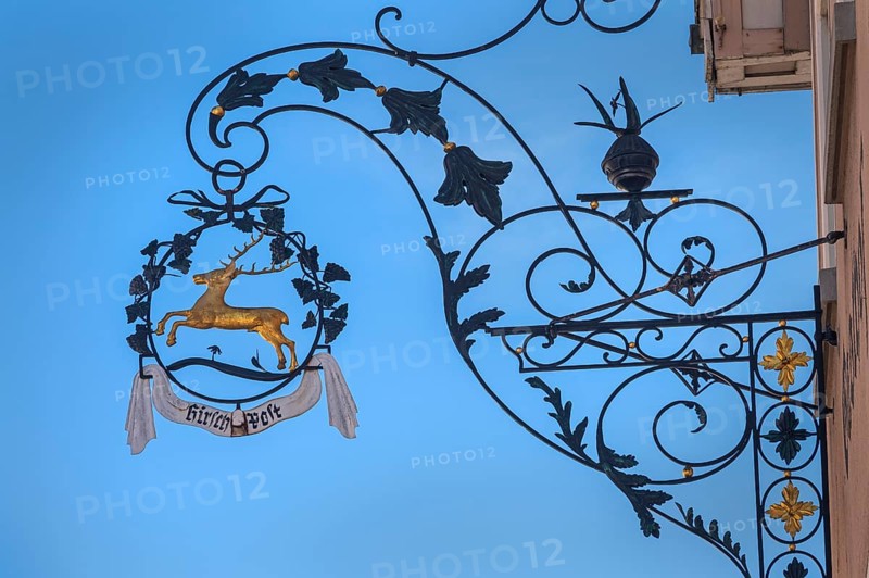 Nose sign with golden stag of the Deer-Post restaurant in Kisslegg, Allgäu, Baden-Württemberg, Germany