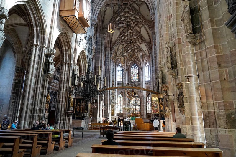 Large church room with pews and Gothic architecture, visited by people, Church of St. Lawrence, Nuremberg, Middle Franconia, Franconia, Bavaria, Germany