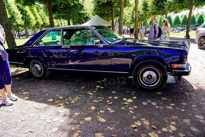 Oldtimer Classic, Gala International Concours d'Elegance Schwetzingen 2025, Germany, Europe, side view of a dark blue Rolls-Royce Camargue in a park-like setting