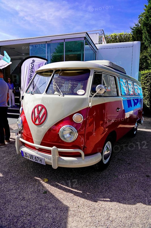 Oldtimer Classic, Gala International Concours d'Elegance Schwetzingen 2025, Germany, Europe, A red and white VW Bus classic car at a presentation in the sun