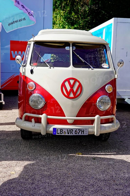 Oldtimer Classic, Gala International Concours d'Elegance Schwetzingen 2025, Germany, Europe, A red and white VW Bus classic car stands in a car park in the sunshine