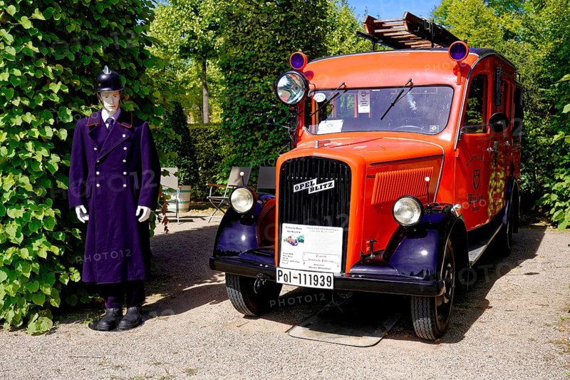 Oldtimer Classic, Gala International Concours d'Elegance Schwetzingen 2025, Germany, Europe, Historic fire engine next to a mannequin in uniform