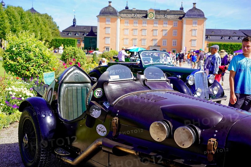 Oldtimer Classic, Gala International Concours d'Elegance Schwetzingen 2025, Germany, Europe, Black classic car with purple details in front of a historic building at an event