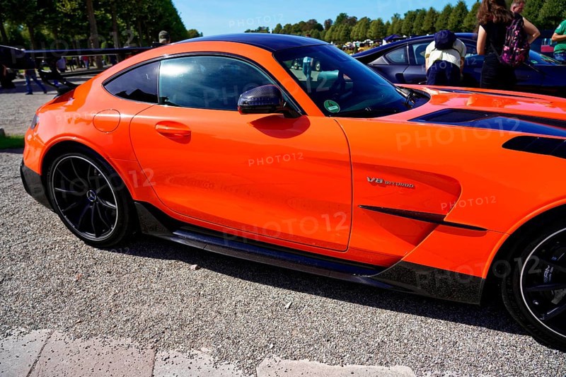 Oldtimer Classic, Gala International Concours d'Elegance Schwetzingen 2025, Germany, Europe, Side view of a modern orange sports car in sunny weather