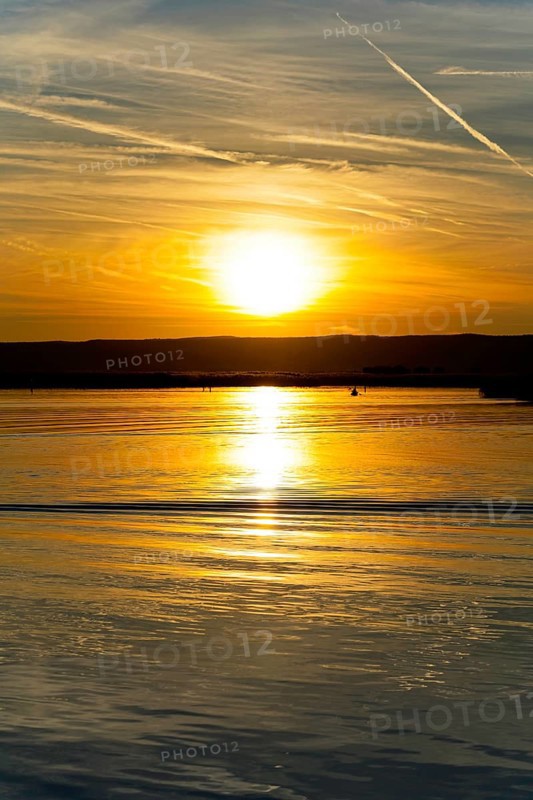 Lake Neusiedl, Burgenland, Austria, Europe, Sunset paints the sky in vivid colours while the water rests still, Sailing boats on Lake Neusiedl