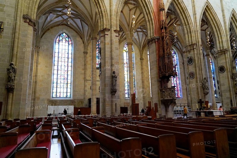 The interior of the largest Protestant church in Germany. It has the world's tallest church tower, Ulm Minster, Germany, Europe, Interior view of a Gothic church with tall columns and colourful stained glass windows, Ulm