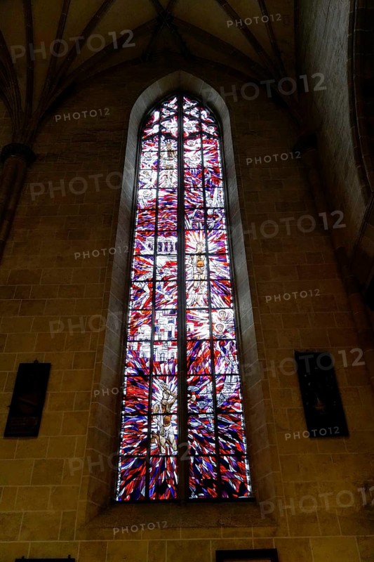 The interior of the largest Protestant church in Germany. It has the world's highest church tower, Ulm Minster, Germany, Europe, Large church window with colourful stained glass in Gothic architecture, Ulm