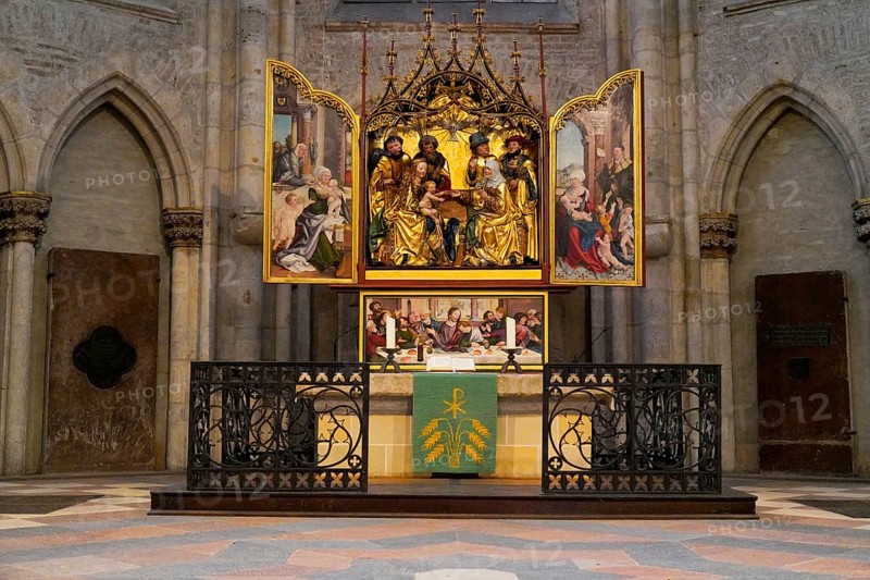 The interior of the largest Protestant church in Germany. It has the world's highest church tower, Ulm Minster, Germany, Europe, Altar with ornate paintings in a Gothic church interior, Ulm