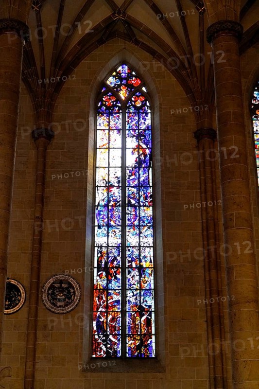 The interior of the largest Protestant church in Germany. It has the world's highest church tower, Ulm Minster, Germany, Europe, Gothic stained glass window with artistic colours and mystical atmosphere, Ulm