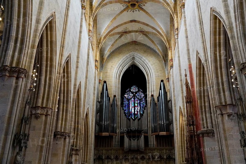 The interior of the largest Protestant church in Germany. It has the world's highest church tower, Ulm Minster, Germany, Europe, Majestic nave of a cathedral with a large organ and impressive stained glass window, Ulm