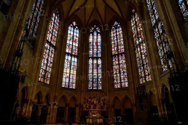 The interior of the largest Protestant church in Germany. It has the world's tallest church tower, Ulm Minster, Germany, Europe, Gothic church interior with large stained glass windows and an altar, Ulm
