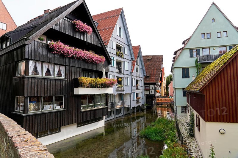 The picturesque fishermen's quarter in Ulm with its beautiful half-timbered houses on the Blau river, Colourful houses with half-timbered facades along a narrow watercourse, Ulm, Germany