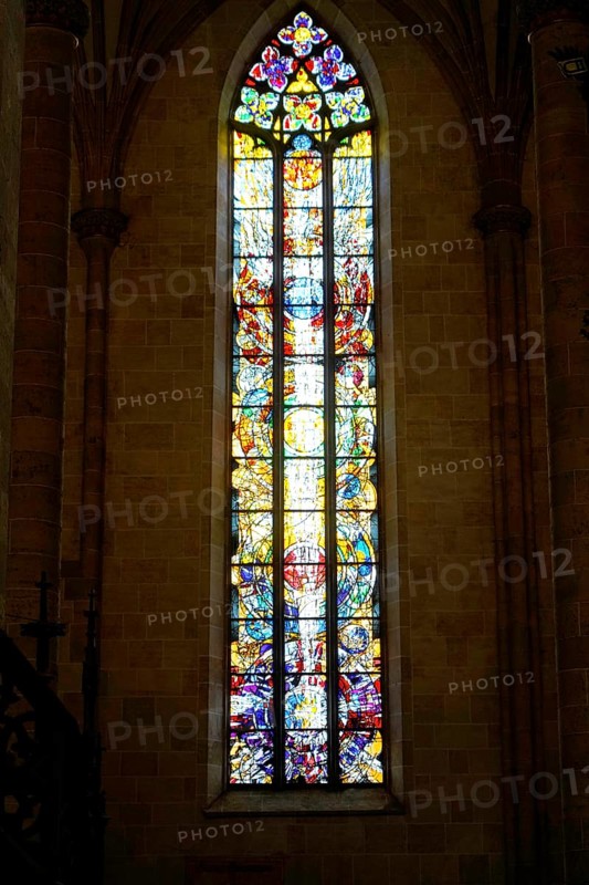 The interior of the largest Protestant church in Germany. It has the world's highest church tower, Ulm Minster, Germany, Europe, Towering, colourful stained glass window with detailed depictions, Ulm