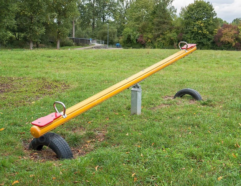 Outdoor playground scenery with Seesaw, lawn and trees