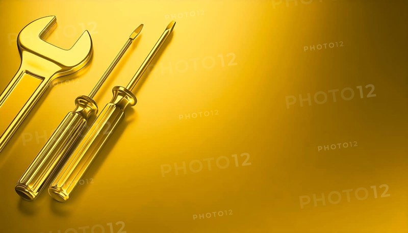 AI generated image showing a golden wrench and screwdrivers in golden ambiance