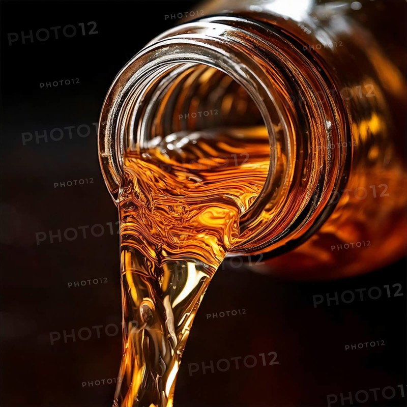 AI-generated close-up image showing a bottle as a clear drink is poured from it, AI generated