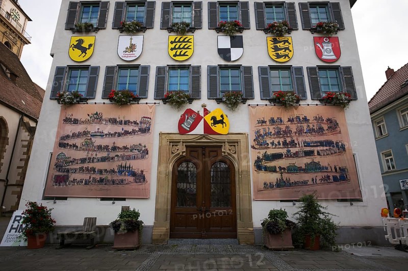 Historical depiction of a folk festival procession, coat of arms, at the town hall, Bad Cannstatt, Stuttgart, Baden-Württemberg, Germany