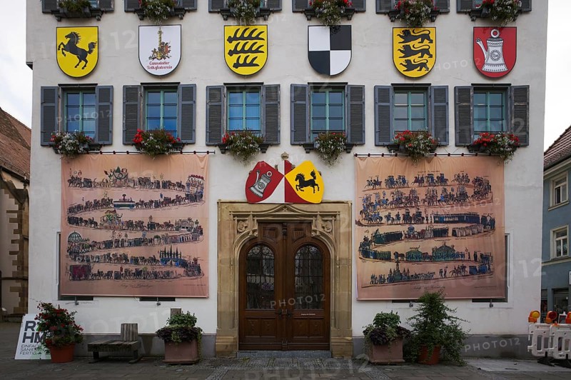 Historical depiction of a folk festival procession, coat of arms, at the town hall, Bad Cannstatt, Stuttgart, Baden-Württemberg, Germany