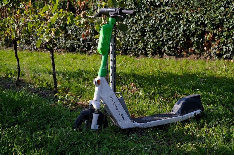 E-scooter, electric scooter, scooter parked in the vineyard next to vines, in the bike rental of the company Lime, OnLime and Uber, Bad Cannstatt, Stuttgart, Baden-Württemberg, Germany