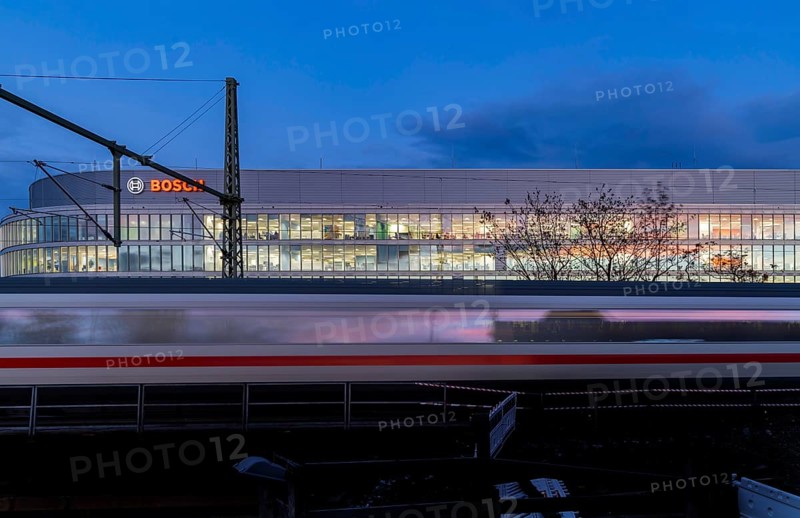 Office building of Bosch GmbH in Feuerbach. Bosch Digital, Bosch IT-Campus, building 701, in front of a passing ICE train of Deutsche Bahn AG. Stuttgart, Baden-Württemberg, Germany