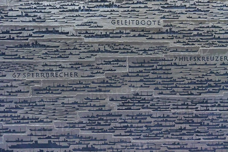 Large number of ship silhouettes on grey metal plate with German texts on ship types, naval memorial, Laboe, Kiel Fjord, Schleswig-Holstein, Germany