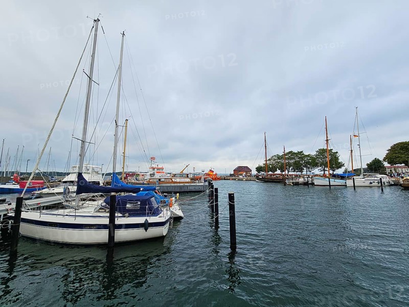 Sailboats and yachts in the harbour under a grey sky, surrounded by water and harbour structures, Laboe, Kiel Fjord, Schleswig-Holstein, Germany