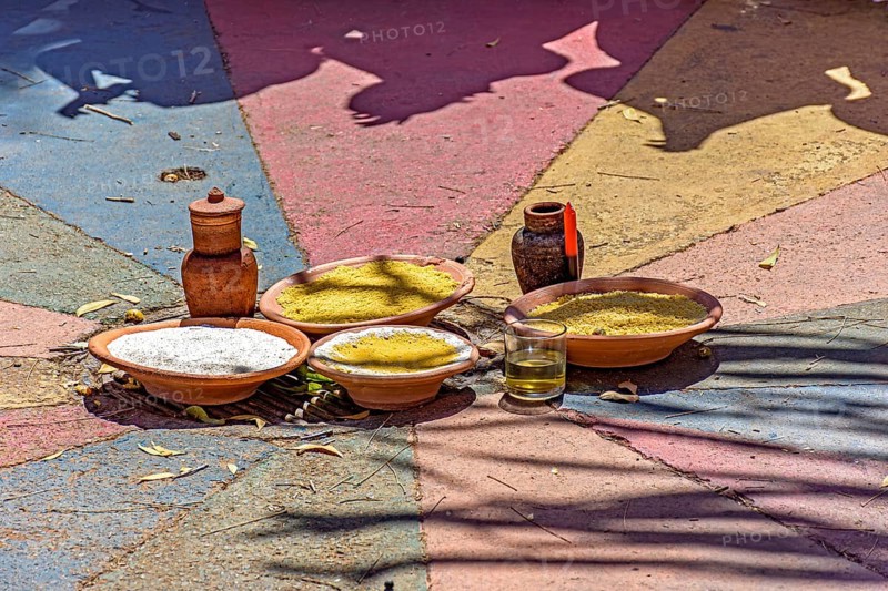 Food on a clay plate being offered to Exu in an Umbanda and Candomble party