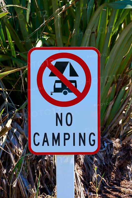 Sign prohibiting camping in a natural environment, West Coast, South Island, New Zealand